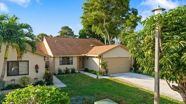 view of front facade with a garage and a front lawn