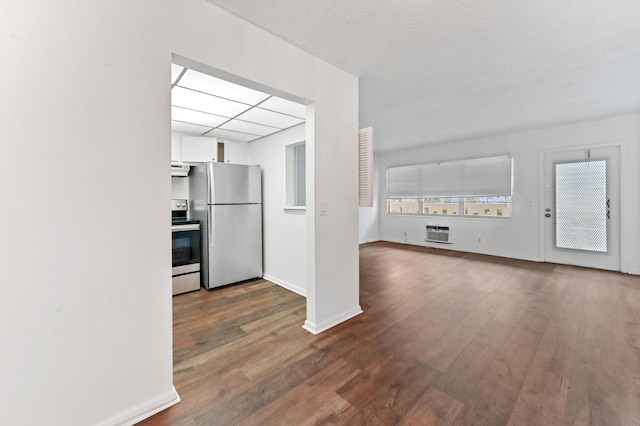 kitchen featuring white cabinets, appliances with stainless steel finishes, and dark hardwood / wood-style floors