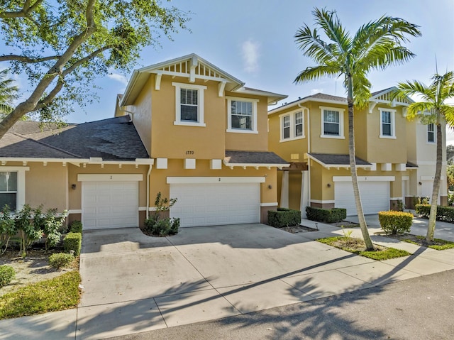 multi unit property featuring a garage