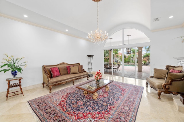 living room with a towering ceiling and an inviting chandelier