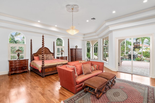 bedroom featuring access to exterior, ornamental molding, and light wood-type flooring