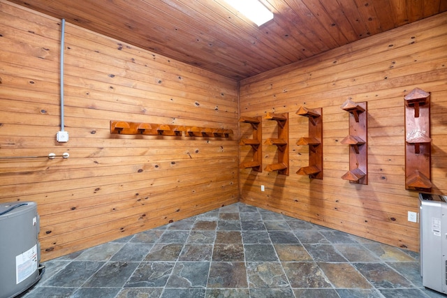 unfurnished room with wooden walls and wooden ceiling