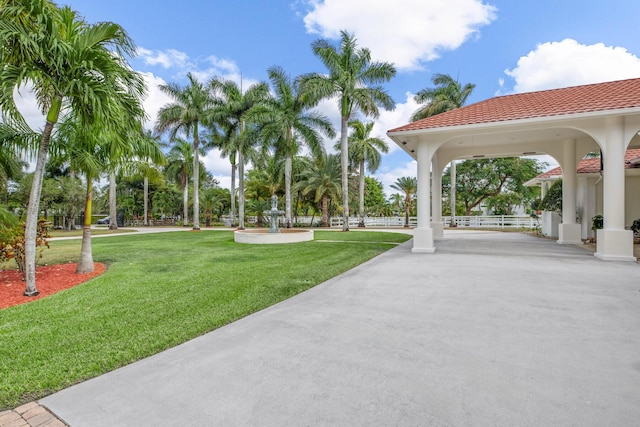 view of property's community with a lawn