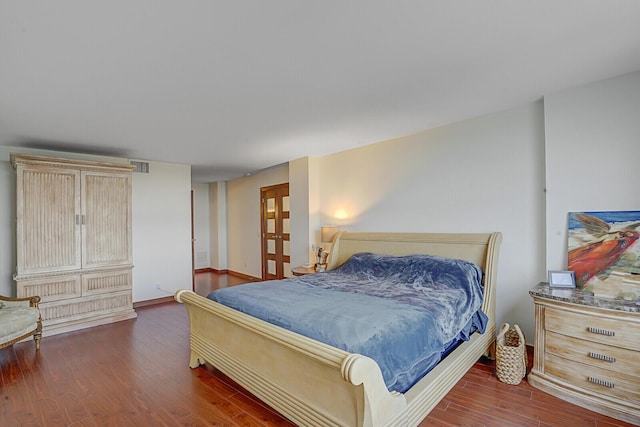 bedroom featuring dark wood-type flooring