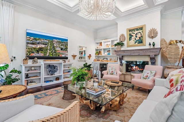 living room featuring crown molding, light hardwood / wood-style flooring, a notable chandelier, a high end fireplace, and beverage cooler