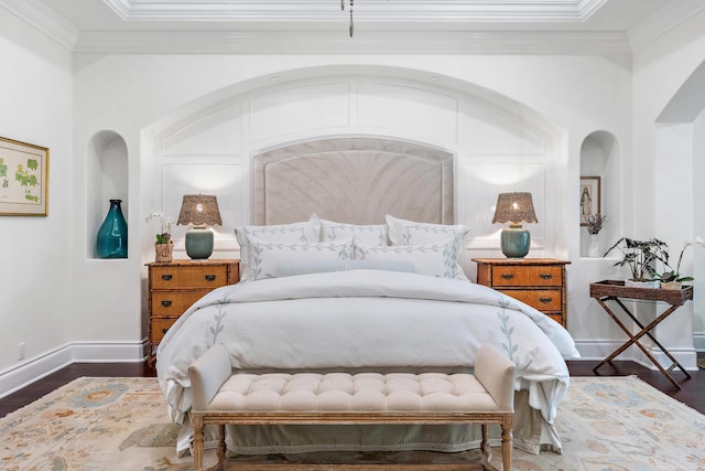 bedroom featuring ornamental molding and dark hardwood / wood-style floors