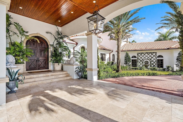 doorway to property featuring a patio area