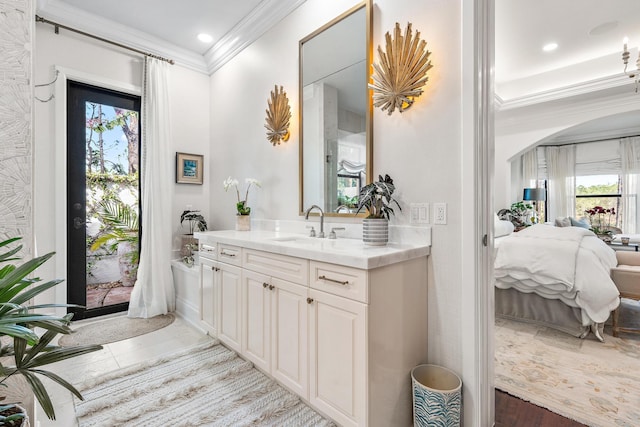 bathroom with vanity and ornamental molding