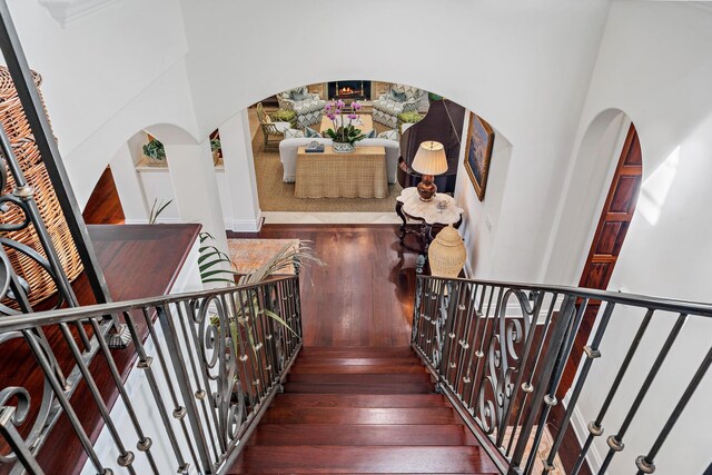 stairway with hardwood / wood-style flooring