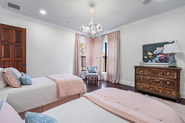 bedroom featuring ornamental molding, dark wood-type flooring, and a chandelier