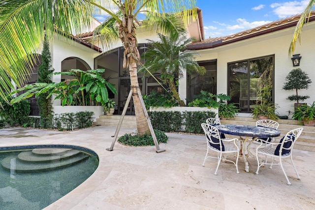 view of patio with a fenced in pool