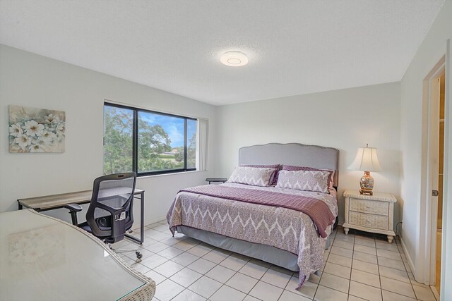 washroom with ceiling fan, light tile patterned flooring, and washer and dryer