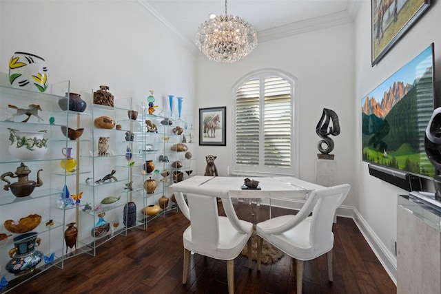 dining area featuring crown molding, dark hardwood / wood-style flooring, and a chandelier