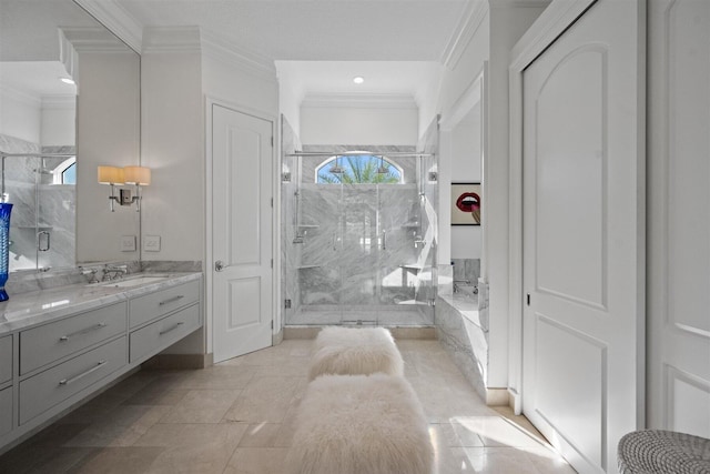 bathroom with vanity, crown molding, and a shower with shower door