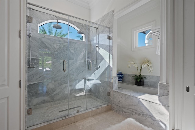 bathroom featuring crown molding, tile patterned flooring, and walk in shower