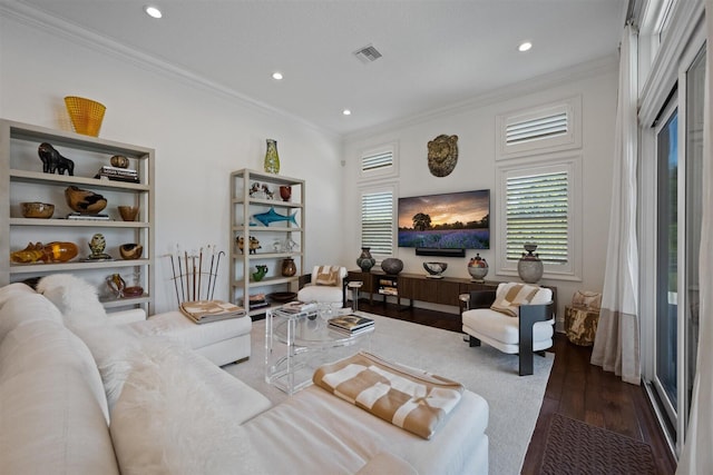 living room with dark hardwood / wood-style flooring and ornamental molding