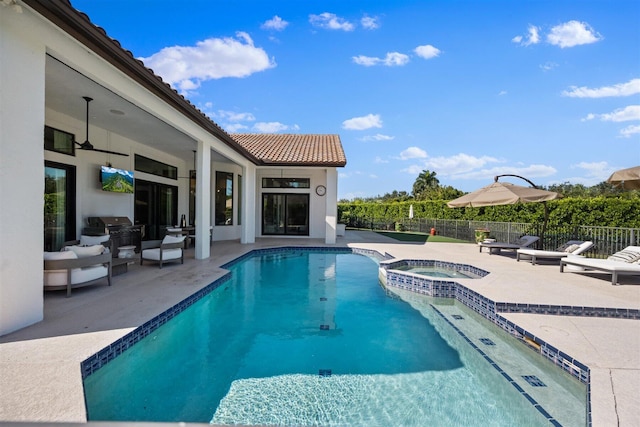 view of pool with area for grilling, an in ground hot tub, and a patio