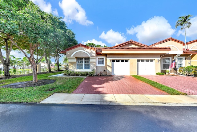 mediterranean / spanish house featuring a garage