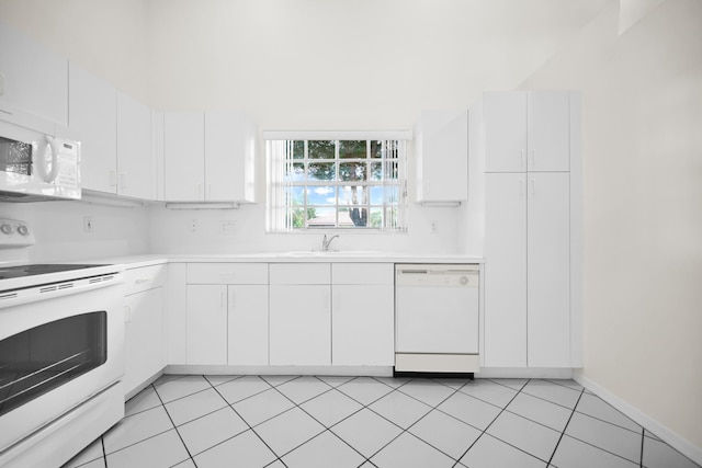 kitchen featuring white cabinets, white appliances, and sink