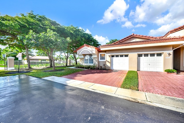 mediterranean / spanish house featuring a garage