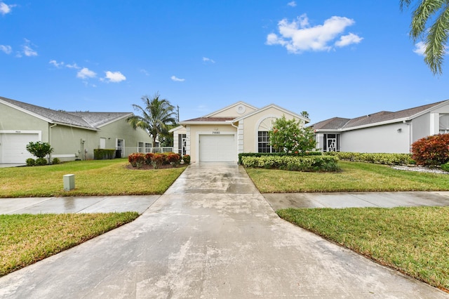 ranch-style house with a front yard and a garage