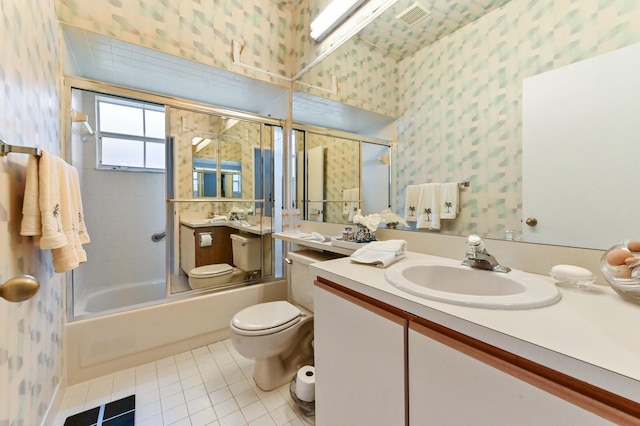 full bathroom featuring tile patterned flooring, vanity, enclosed tub / shower combo, and toilet