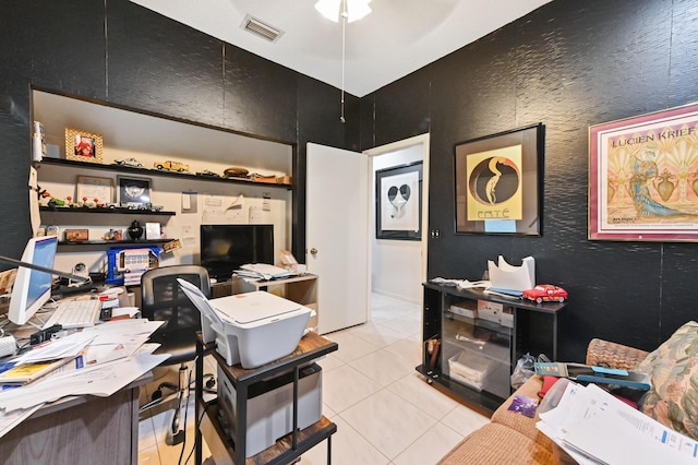 office featuring light tile patterned floors and ceiling fan