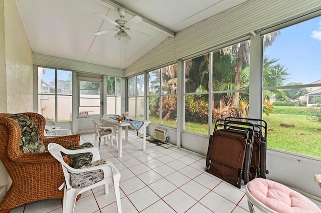 sunroom featuring lofted ceiling with beams and ceiling fan