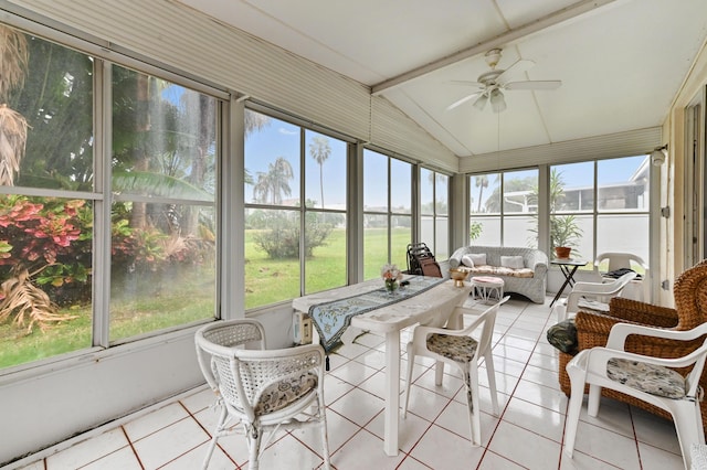 sunroom / solarium with ceiling fan and lofted ceiling