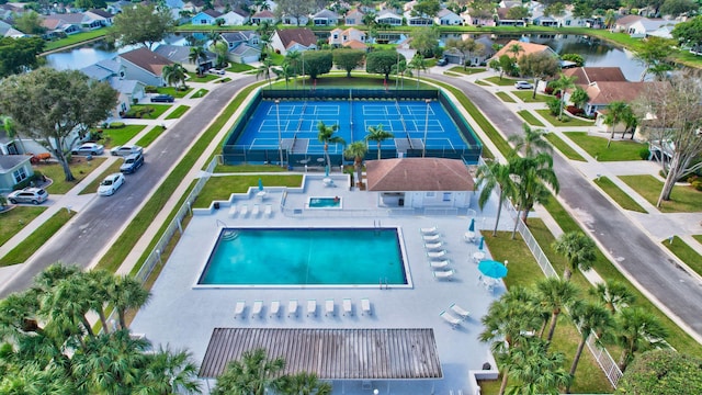 birds eye view of property with a water view