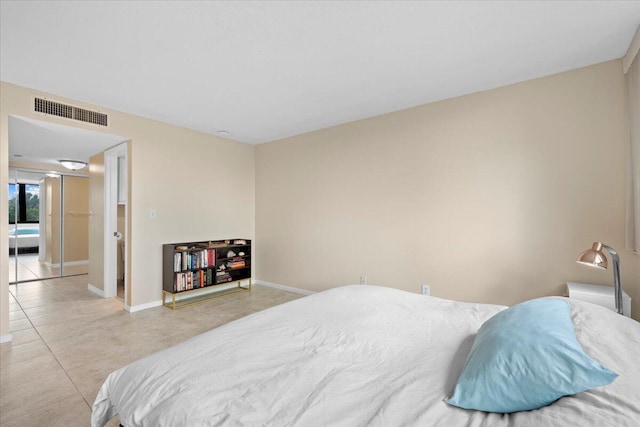 bedroom featuring light tile patterned floors