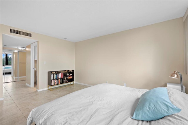 1605 S US Highway 1 Unit 203-M1, Jupiter, FL 33477 - tiled bedroom featuring baseboards