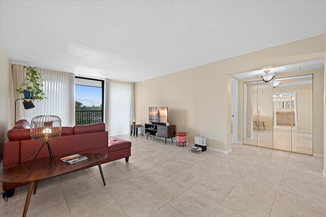 living room with a textured ceiling