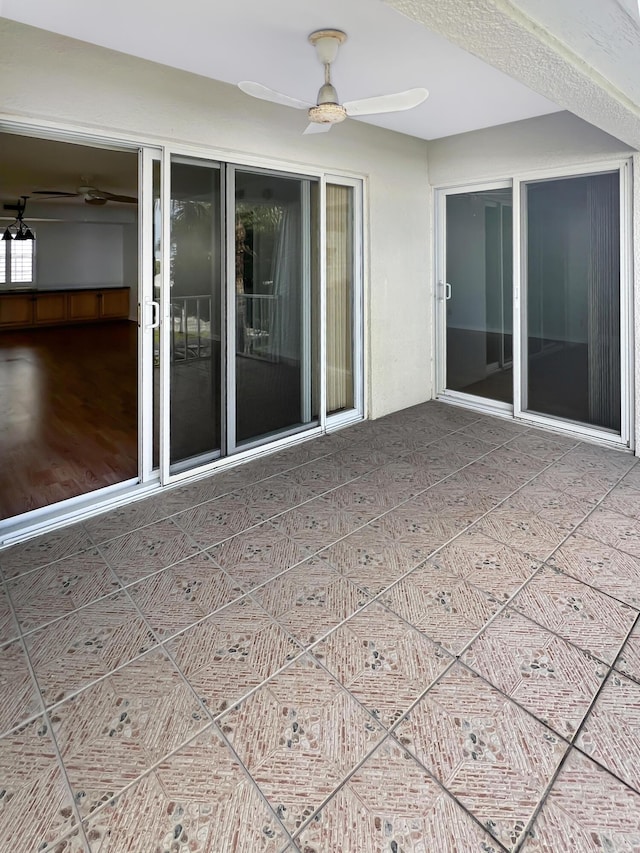 view of patio featuring ceiling fan