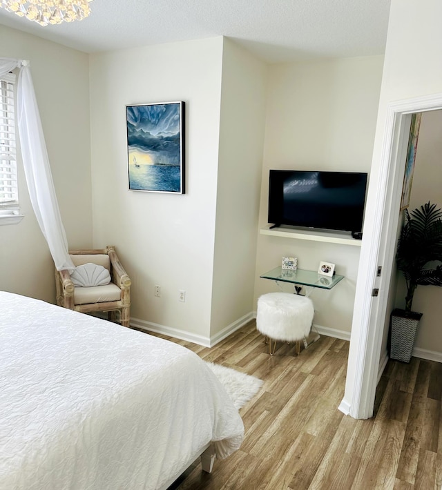 bedroom featuring wood-type flooring