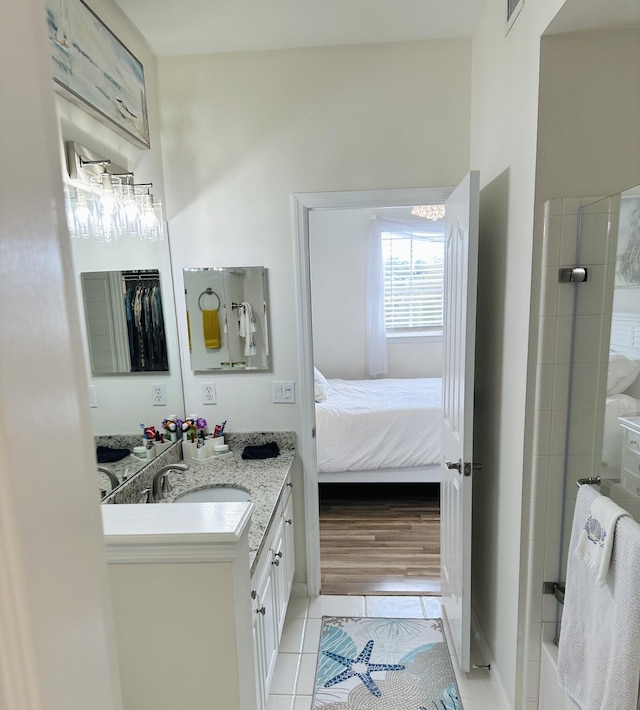 bathroom featuring tile patterned floors and vanity