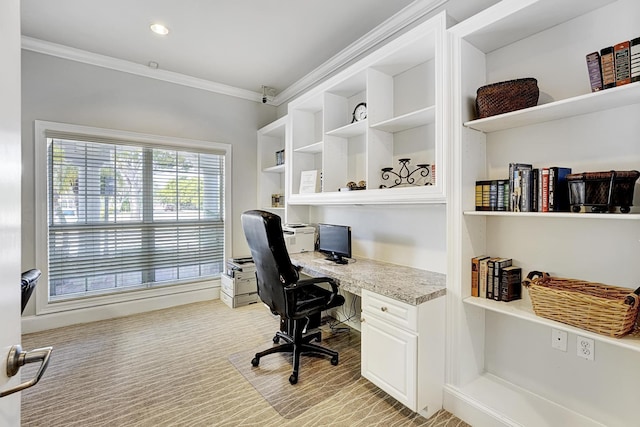 home office featuring ornamental molding and built in desk