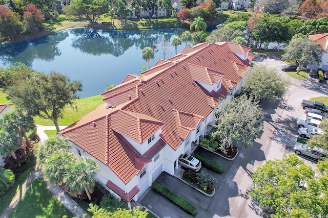 birds eye view of property featuring a water view