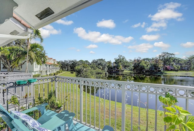 balcony featuring a water view