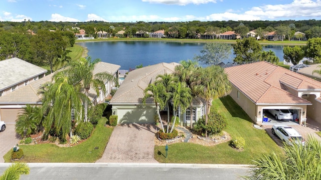 birds eye view of property with a water view