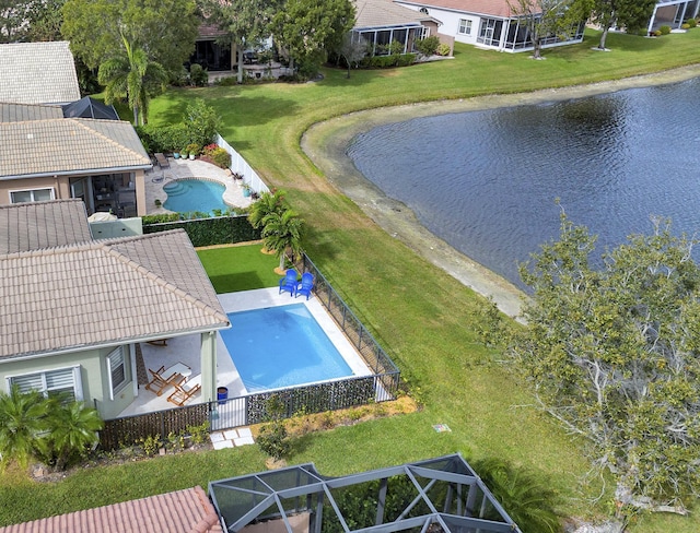 birds eye view of property with a water view