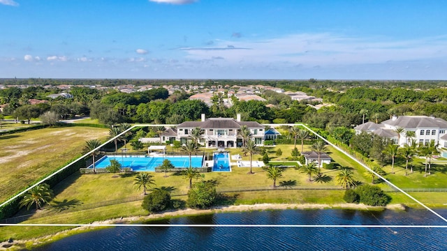 birds eye view of property with a water view