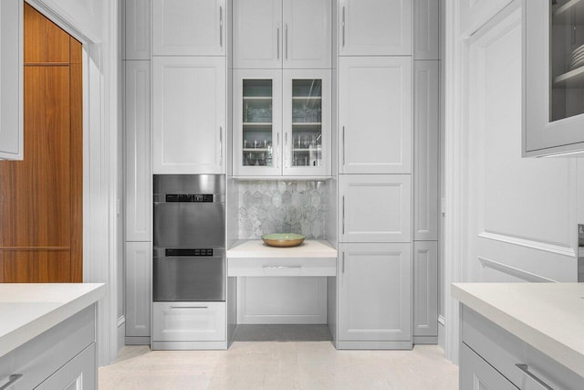 kitchen with white cabinets and backsplash