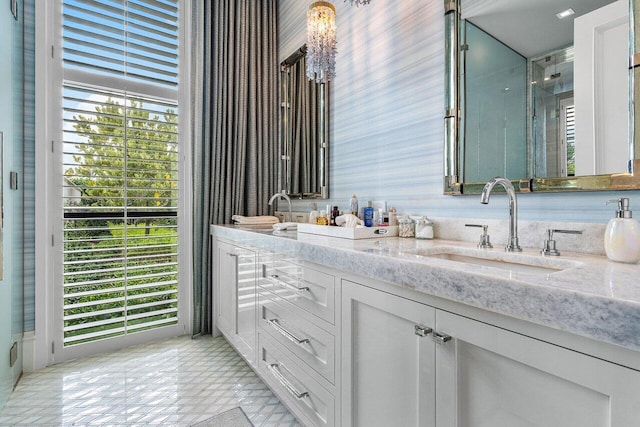 bathroom with a healthy amount of sunlight and vanity