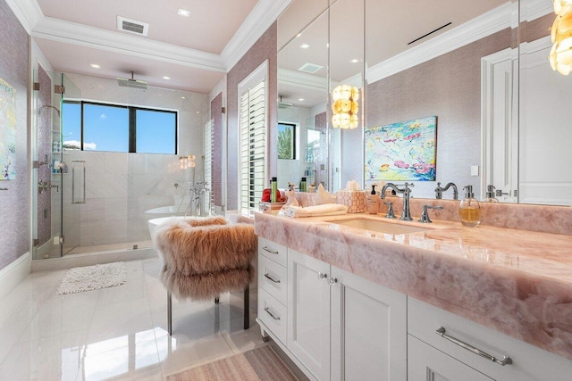 bathroom featuring a shower with door, crown molding, and vanity