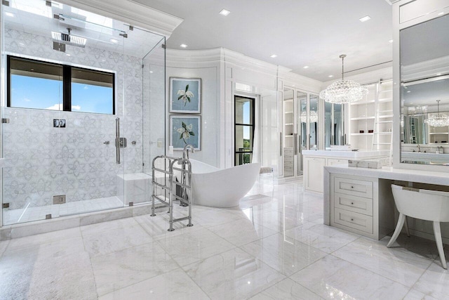 bathroom with ornamental molding, vanity, plus walk in shower, and a notable chandelier