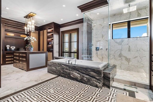 bathroom with shower with separate bathtub, ornamental molding, and an inviting chandelier