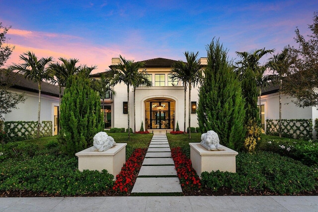 mediterranean / spanish-style house with french doors