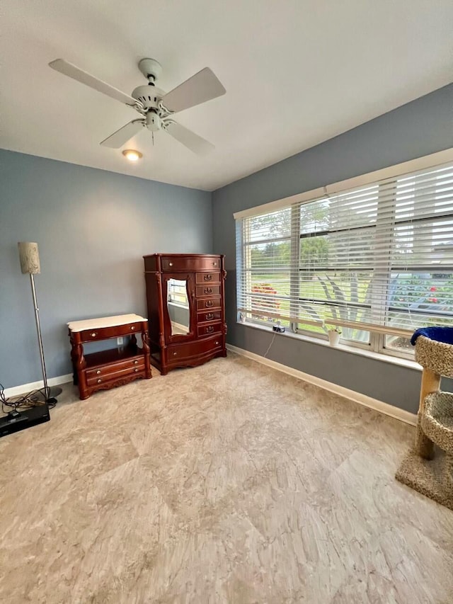 interior space featuring ceiling fan