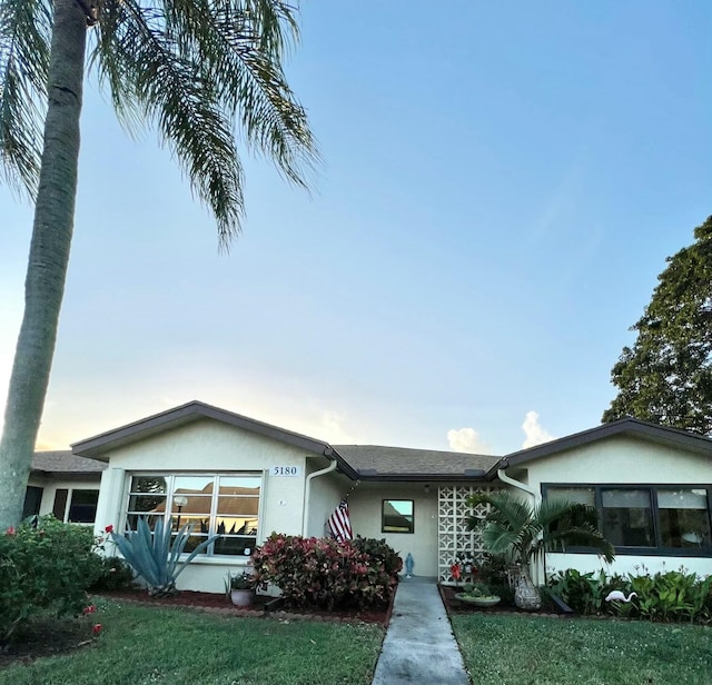 view of front of property with a front lawn